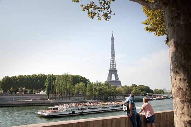 Cruise boat passing the Eiffel Tower on the Seine