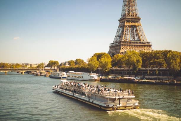 River cruise boat on the Seine with the Eiffel Tower