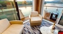 River cruise cabin with private balcony and water views